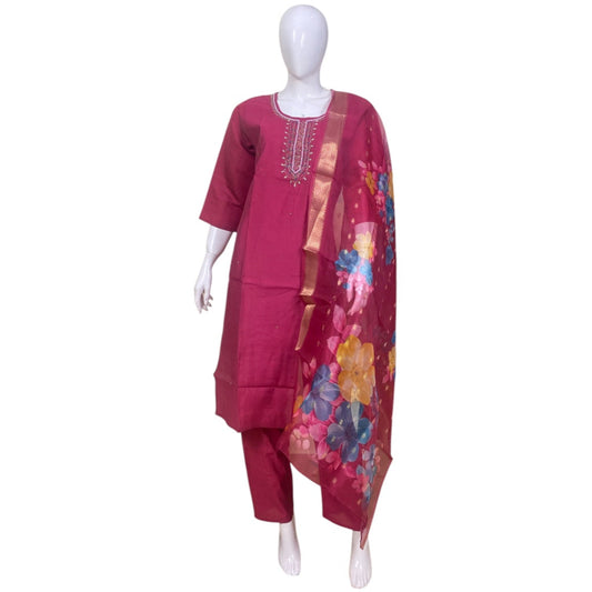 Mannequin wearing a red outfit with a floral scarf on a white background