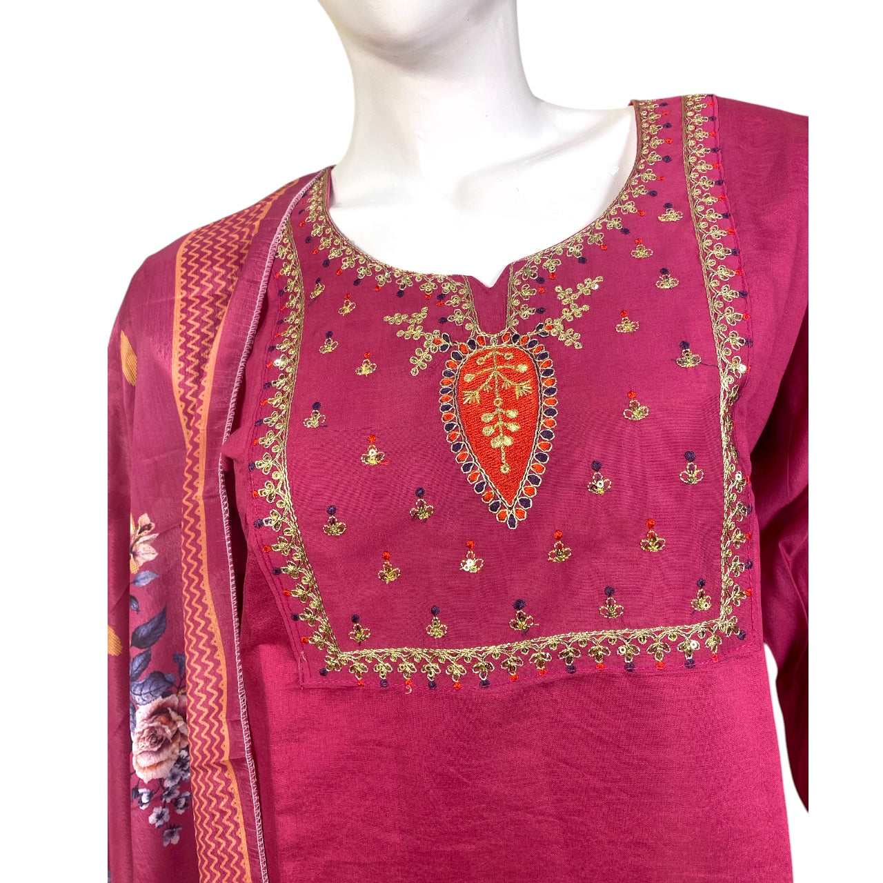 Pink embroidered traditional outfit  with a white background